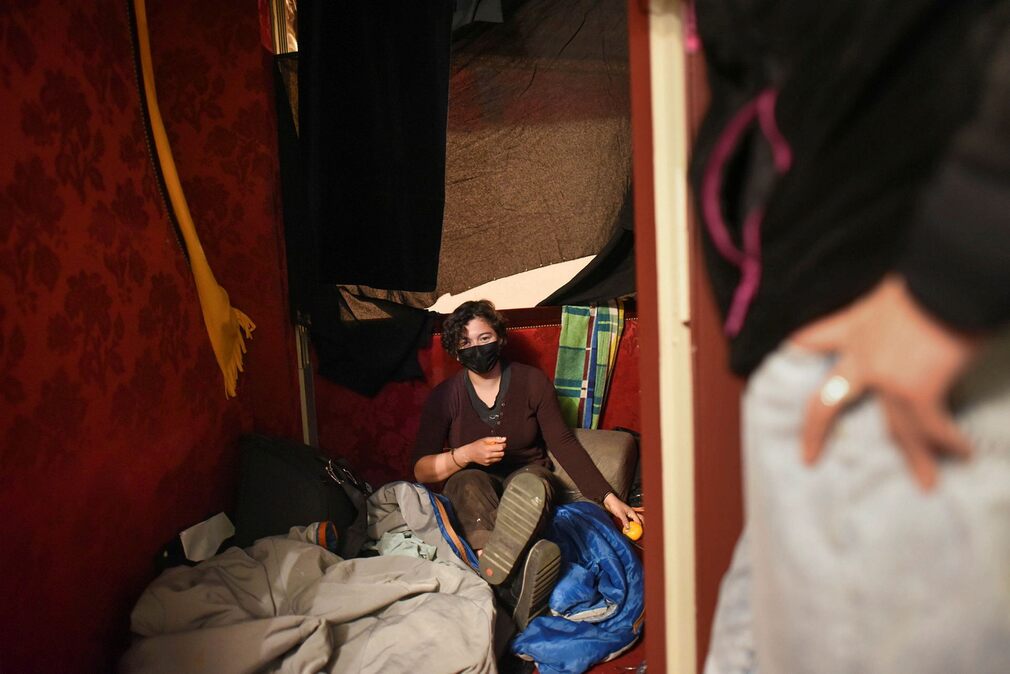 Alessandra Aldana sleeps in a box at the Odeon Theater in Paris.