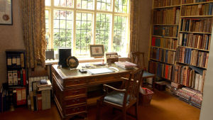 Study Tolkien with the desk and bookshelves.