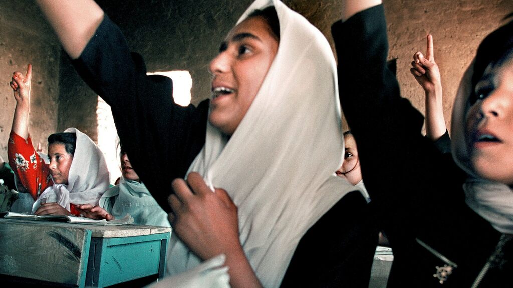 Taliban photograph girls when school reopens