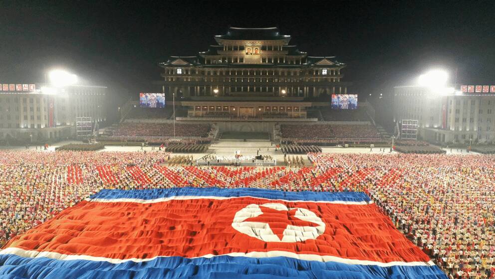 A procession at Kim Il Sung Square in Yongyang, North Korea.  Photo distributed by the state-controlled Korean Central News Agency. 