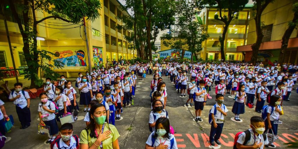 Filipino school children return after more than two years