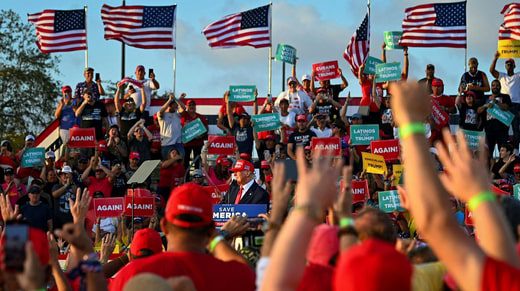 Supporters of former President Donald Trump listen to him at a campaign rally in Florida on Sunday.